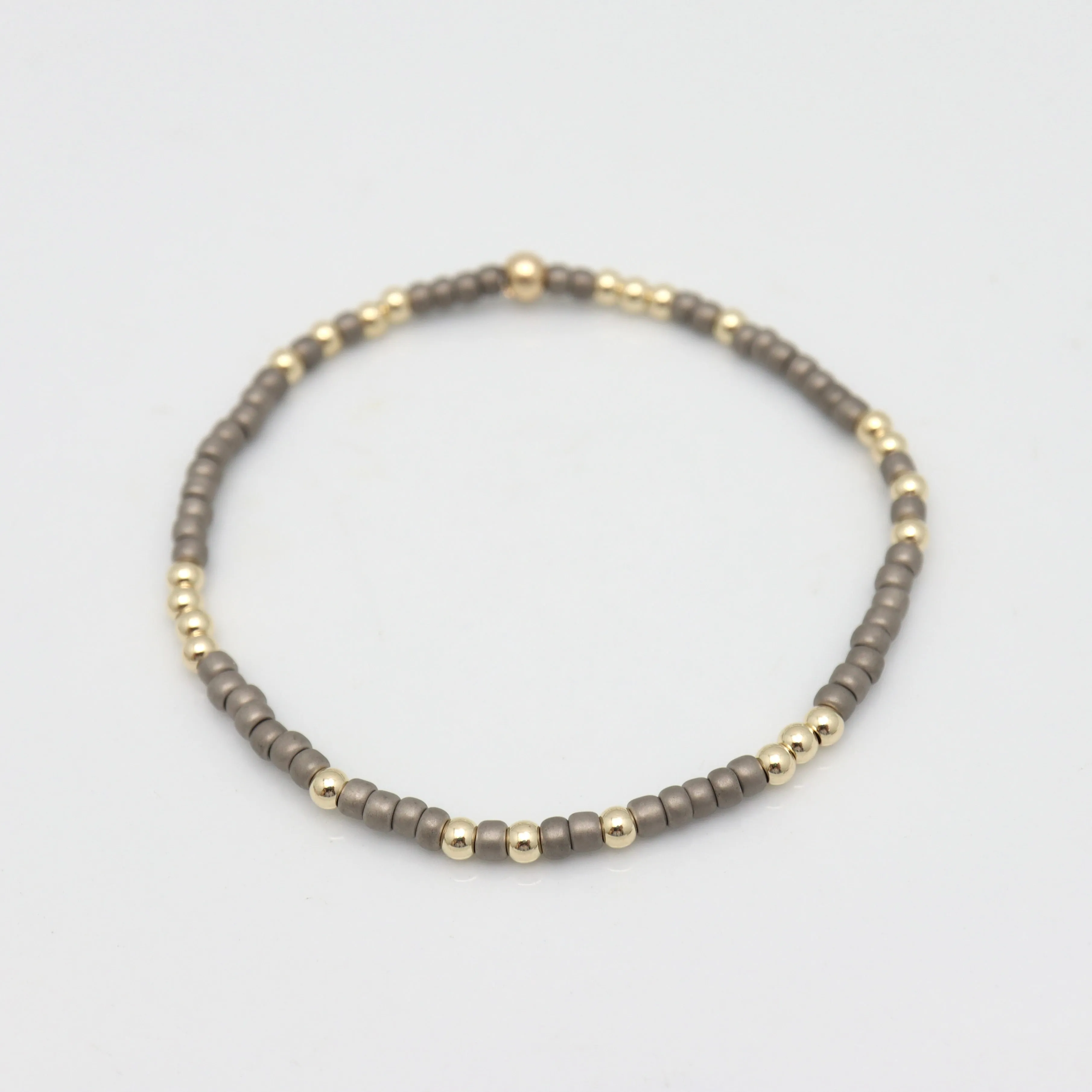 Japanese Toho Seed & Gold Stretch Bracelet - Matte Gun Metal Grey