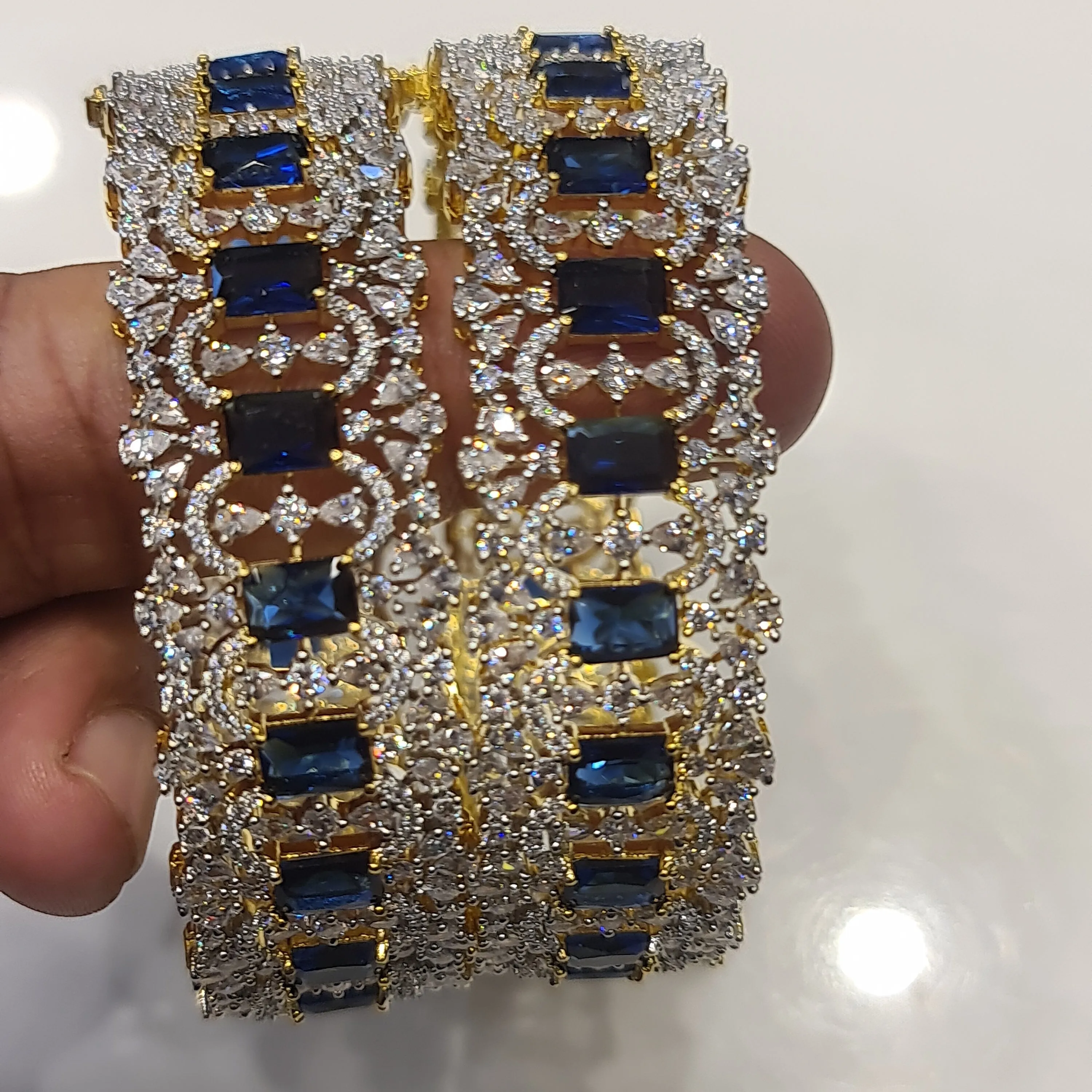 "Sparkle in Style: The Opulent Blue American Diamonds Bangles Set"